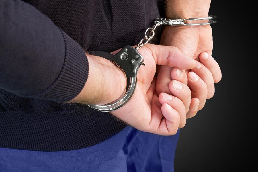 arrested-man-handcuffs-hith-hands-back-1.jpg